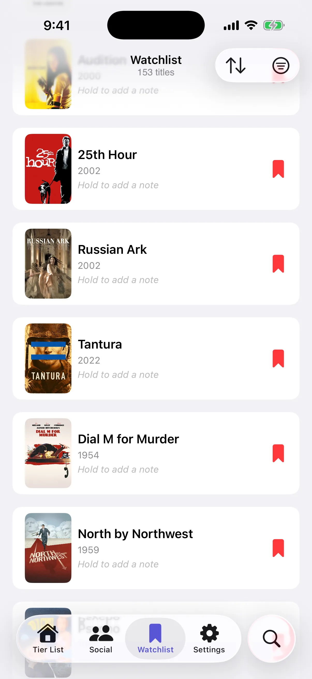 MoviePal watchlist with saved movies and a hint to hold a title to add a note
